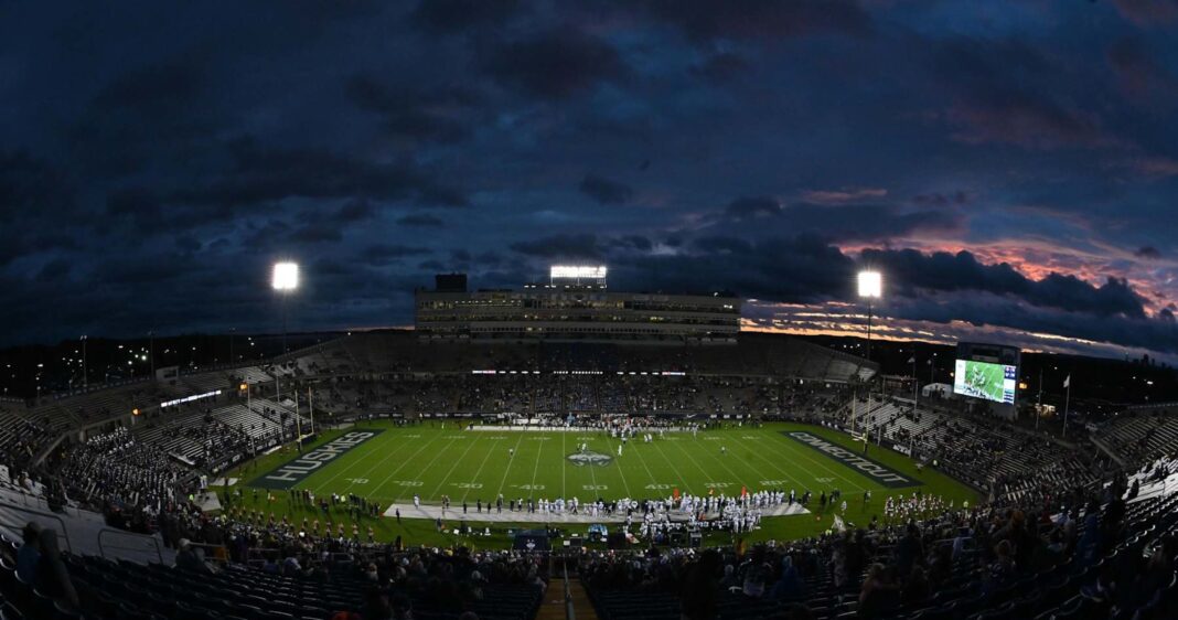 Photo: UConn Becomes 1st CFB Team to Feature NIL Sponsorship Logos on FBS Field